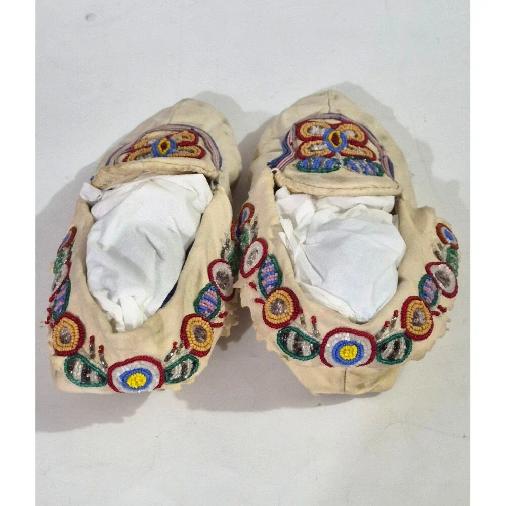 Vintage Crow Beaded Hide Moccasins featuring Intricate Colorful Glass Beadwork